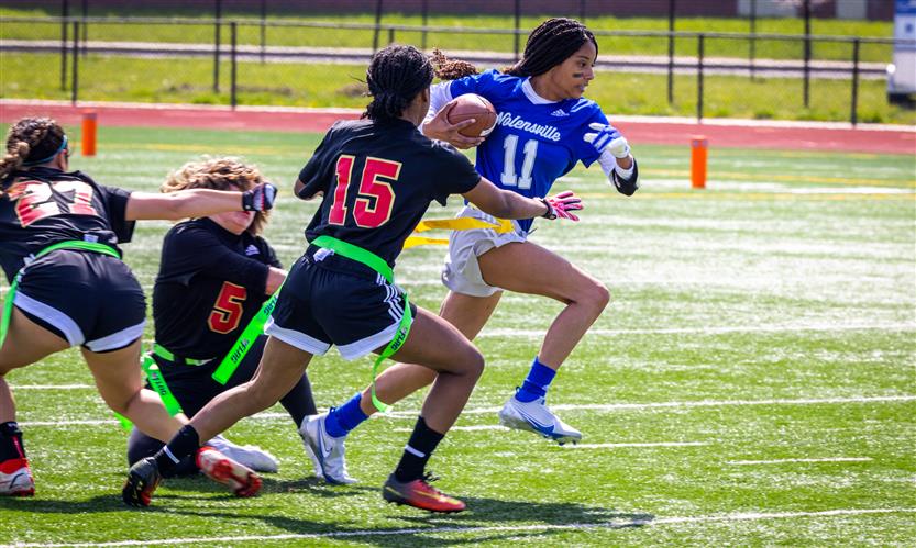 Girls play flag football